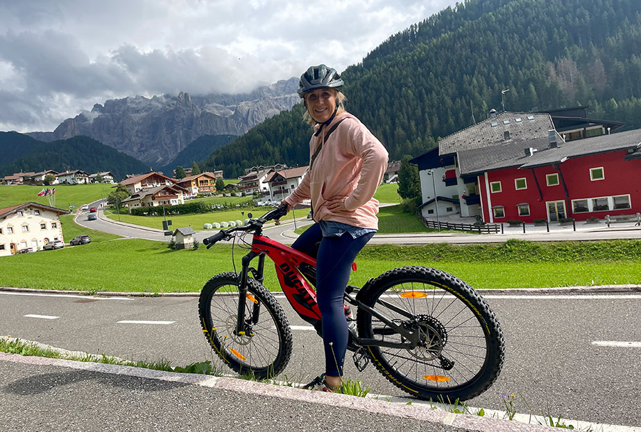 Kerry tries an electric bike against the stunning backdrop of the Dolomites